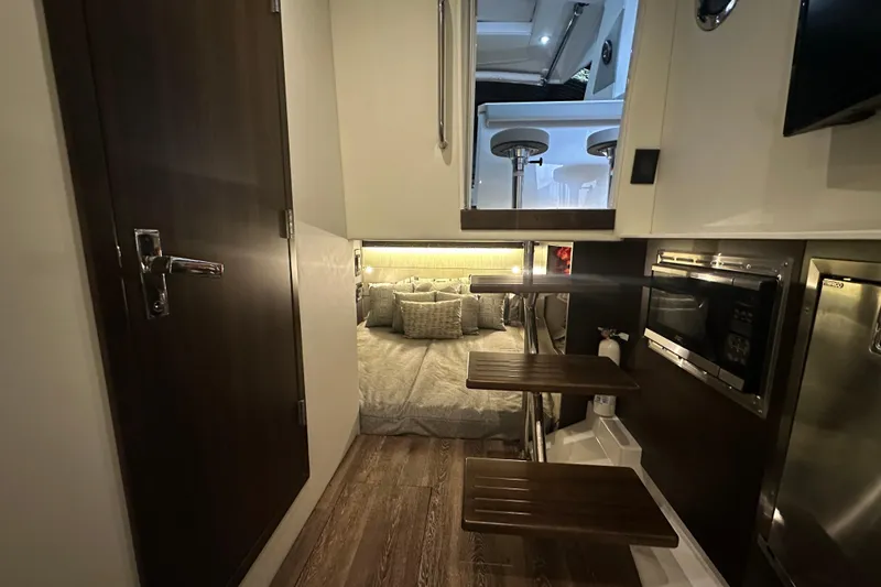 Slide: The Image of 2024 Cruisers Yachts 38 GLS OB interior with cozy cabin and modern amenities. - 15