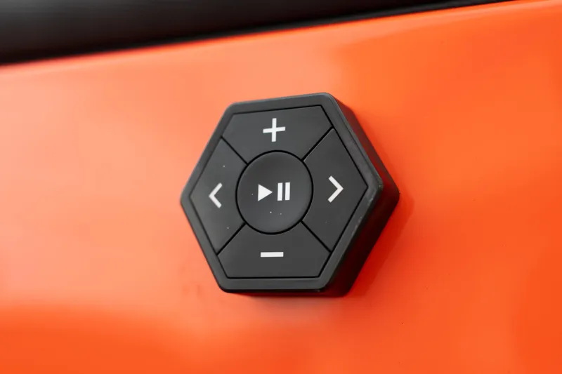 Slide: The Image of Hexagonal control panel on 2026 MasterCraft NXT24 boat, featuring play and volume buttons. - 10