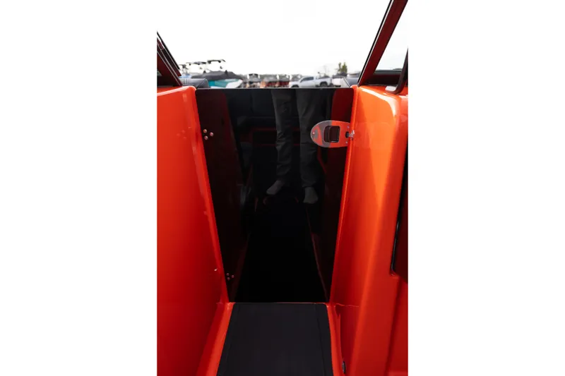 Slide: The Image of 2026 MasterCraft NXT24 boat interior with vibrant orange accents. - 22
