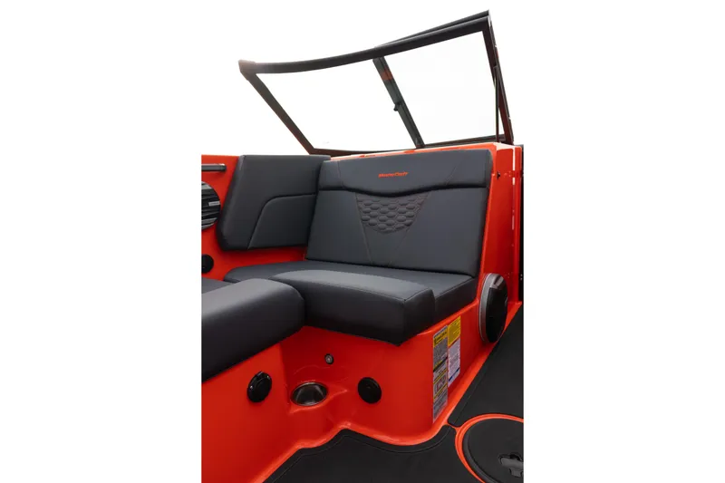 Slide: The Image of 2026 MasterCraft NXT24 boat interior with black seating and vibrant orange accents. - 23