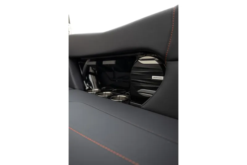 Slide: The Image of 2026 MasterCraft NXT24 interior with Meridian speaker and cup holders. - 34