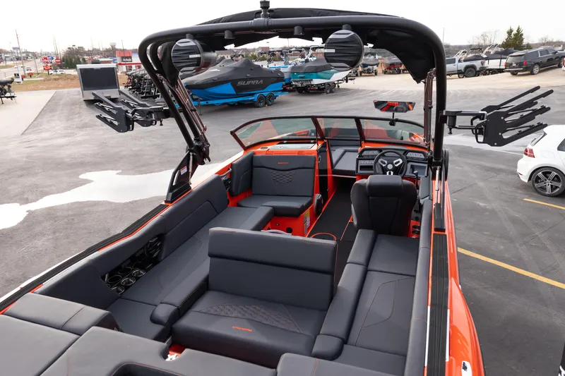 Slide: The Image of 2026 MasterCraft NXT24 boat interior with sleek seating and modern dashboard design. - 38