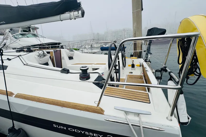 Slide: The Image of 2024 Jeanneau Sun Odyssey 349 sailboat docked in a marina on a foggy day. - 14