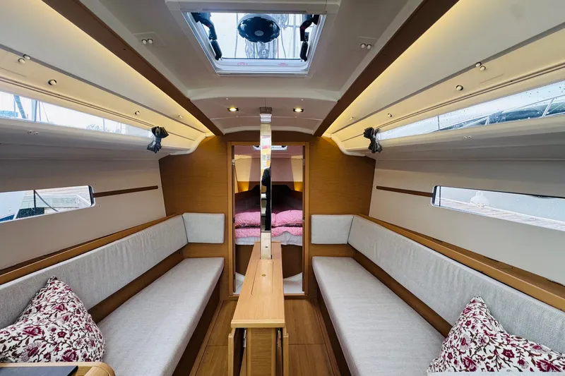 Slide: The Image of Teak deck of 2024 Jeanneau Sun Odyssey 349 sailboat with swim platform. - 27