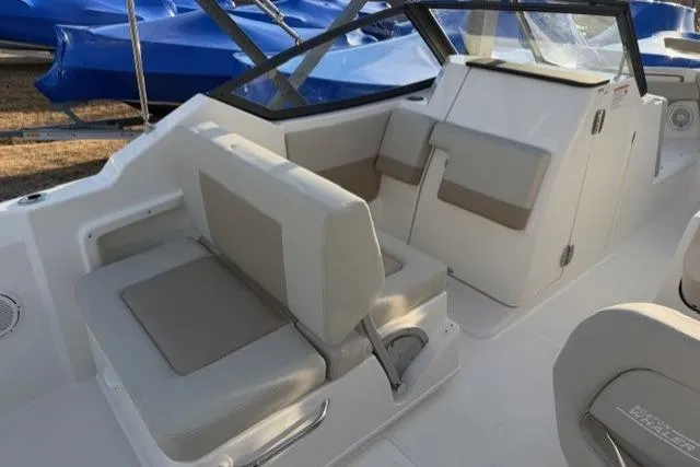 Slide: The Image of 2026 Boston Whaler 210 Vantage boat interior with beige seating and modern design. - 17