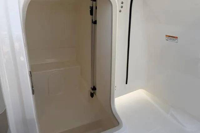 Slide: The Image of Interior storage compartment of 2026 Boston Whaler 210 Vantage boat. - 19