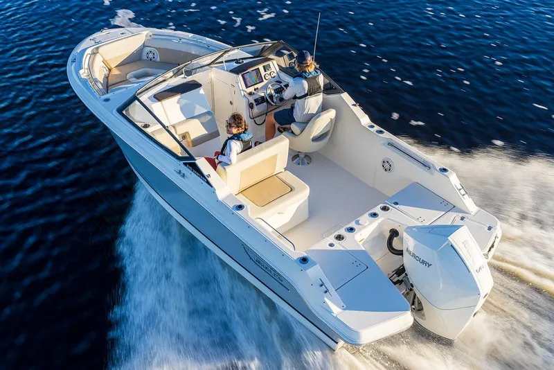 Slide: The Image of 2026 Boston Whaler 210 Vantage boat interior with seating and Mercury 200 engine. - 4