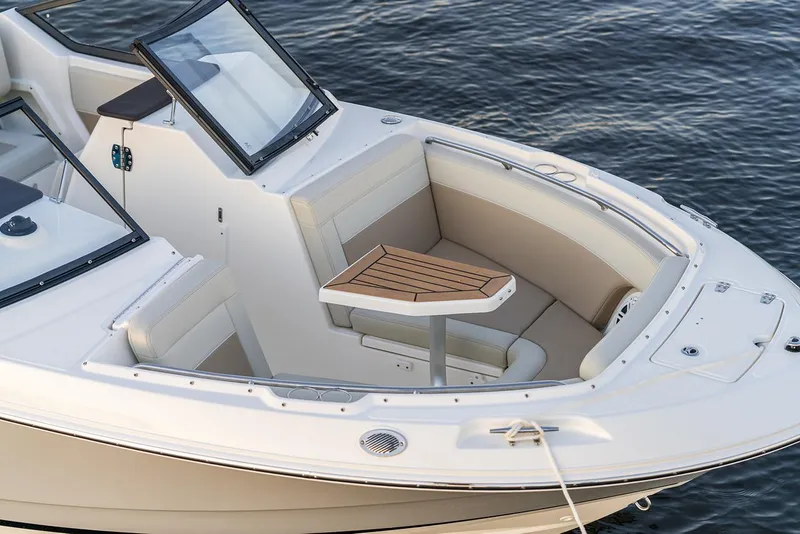 Slide: The Image of 2026 Boston Whaler 210 Vantage boat detail, showing white panel and metal hinges. - 7