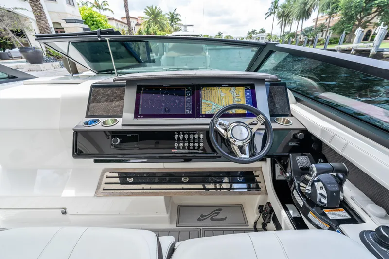 Slide: The Image of 2019 Sea Ray SLX 400 Outboard helm with advanced navigation system and luxurious interior. - 13