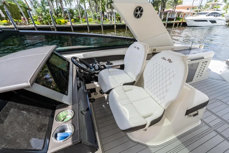 Slide: The Image of 2019 Sea Ray SLX 400 Outboard cockpit with luxurious seating and modern controls. - 22