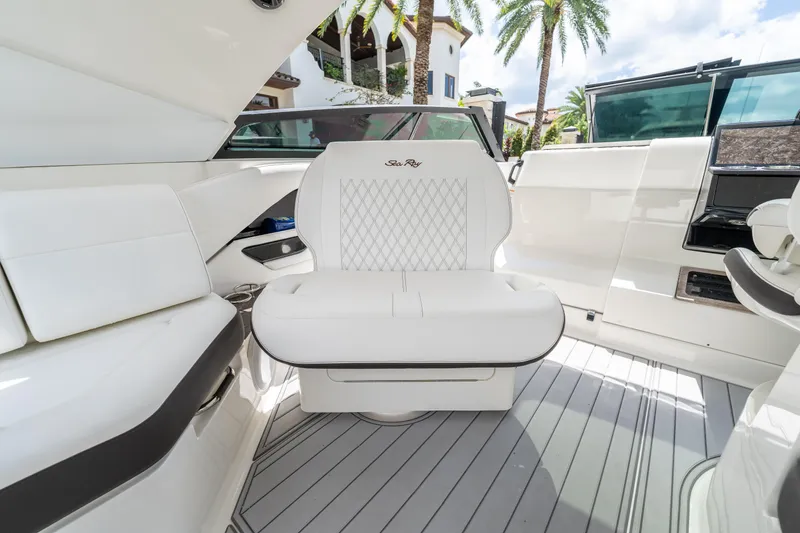 Slide: The Image of Luxurious interior of 2019 Sea Ray SLX 400 Outboard with white seating and modern design. - 24