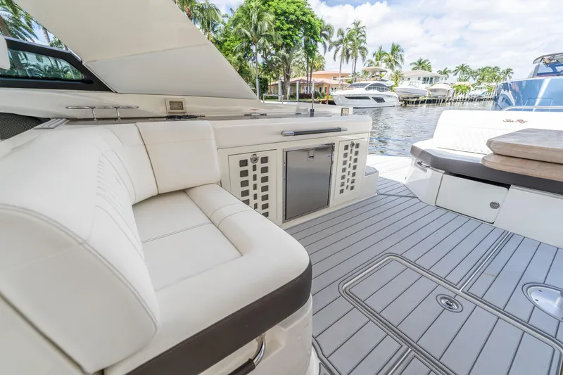Slide: The Image of Luxurious 2019 Sea Ray SLX 400 Outboard boat interior with elegant seating and modern amenities. - 27