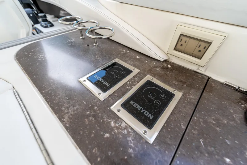 Slide: The Image of Control panel and outlets on 2019 Sea Ray SLX 400 Outboard boat. - 30