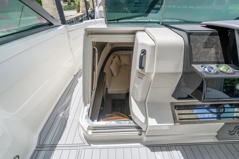 Slide: The Image of 2019 Sea Ray SLX 400 Outboard cabin entrance with sleek interior design. - 47