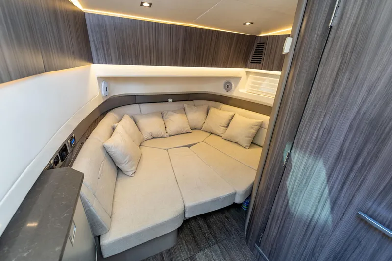 Slide: The Image of Luxurious interior of 2019 Sea Ray SLX 400 Outboard with plush seating and modern design. - 49