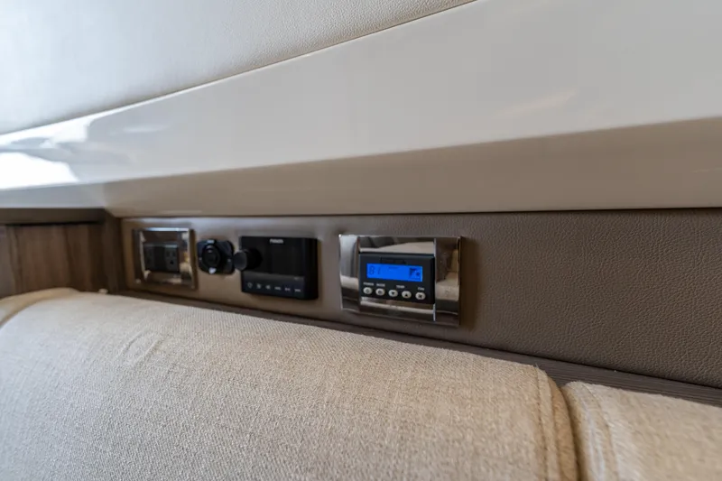 Slide: The Image of 2019 Sea Ray SLX 400 Outboard interior control panel with modern features. - 51