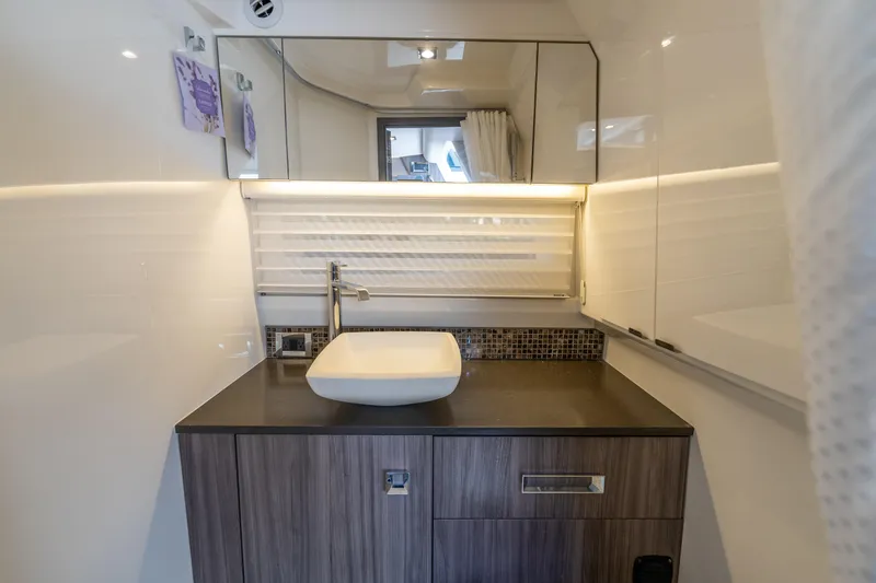 Slide: The Image of Luxurious bathroom interior of 2019 Sea Ray SLX 400 Outboard yacht with modern sink and cabinetry. - 52