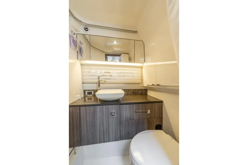 Slide: The Image of Luxurious bathroom interior of 2019 Sea Ray SLX 400 Outboard yacht, featuring modern fixtures. - 54