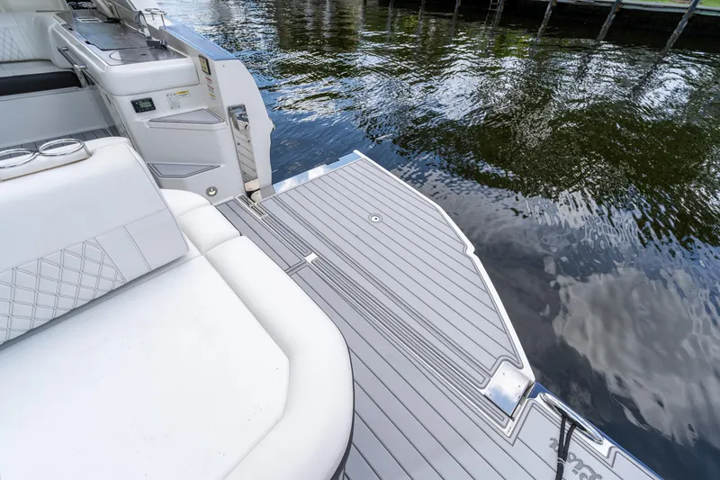 Slide: The Image of 2019 Sea Ray SLX 400 Outboard boat deck with luxurious seating and water view. - 63