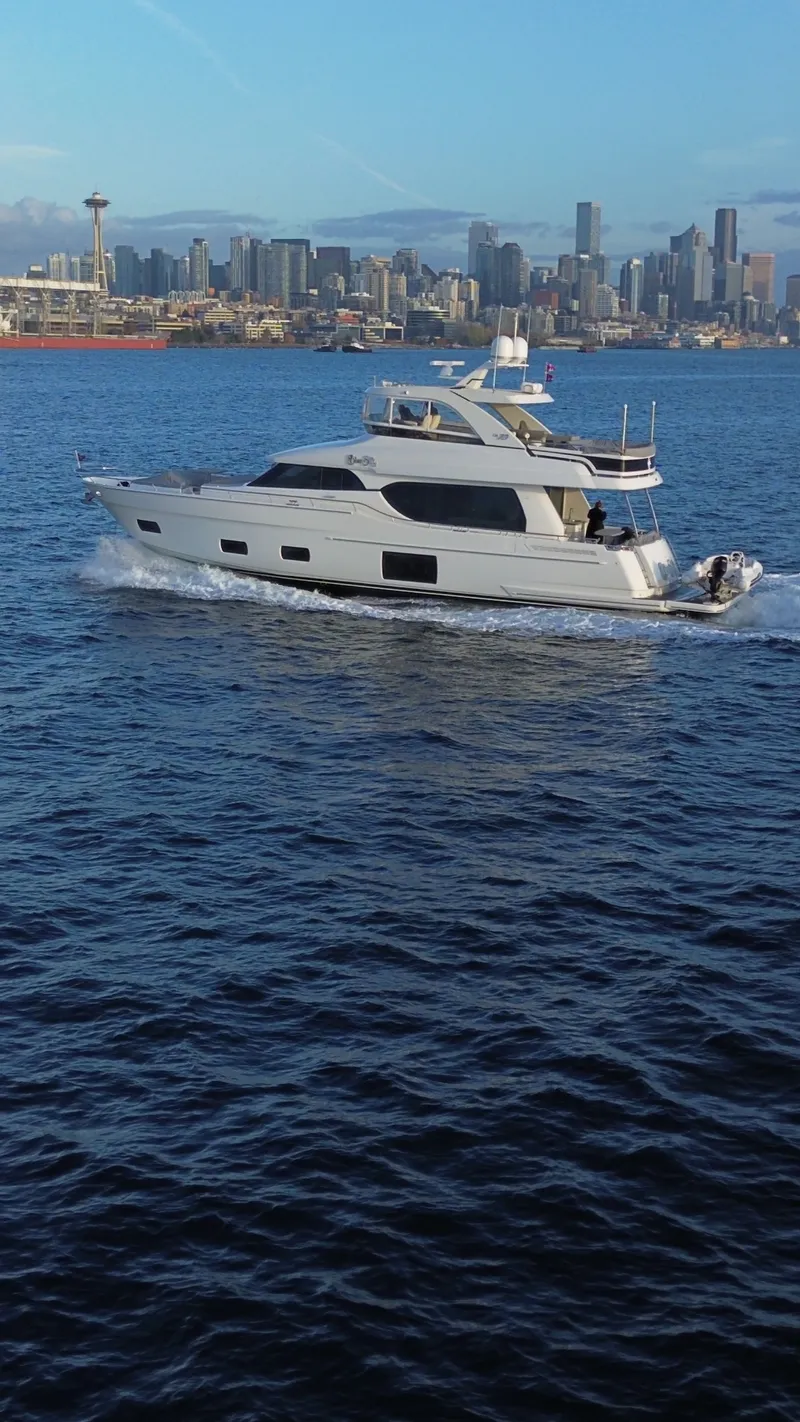 Slide: The Image of Ocean Alexander Evolution 2017 yacht cruising near city skyline. - 7