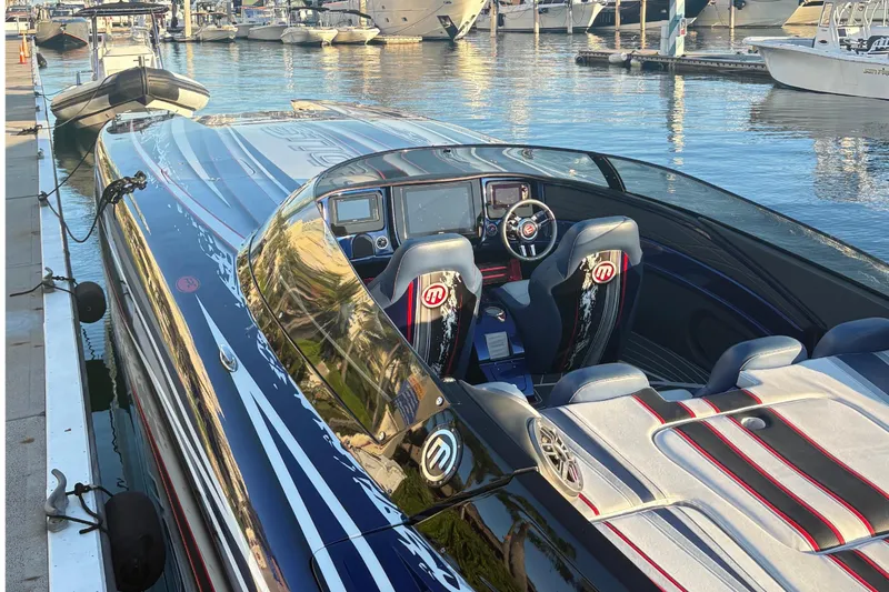 Slide: The Image of 2018 Mystic Powerboats C4400 at dock, luxurious design. - 9