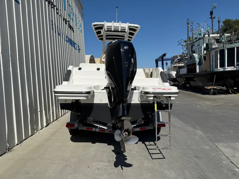 Slide: The Image of 2023 Bayliner Trophy T24CC boat on trailer with Mercury outboard engine. - 6
