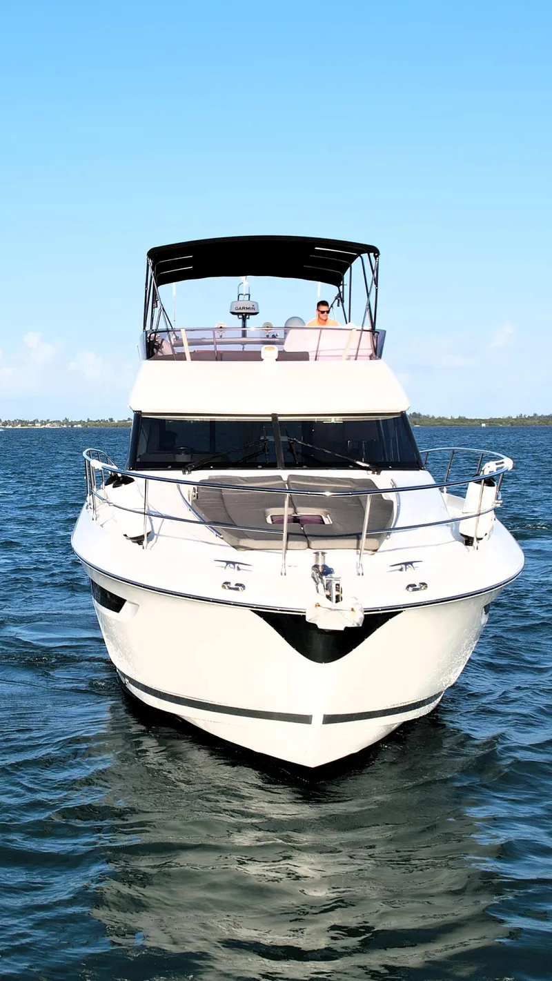 Slide: The Image of 2013 Prestige 50 Flybridge yacht on open water, front view. - 19