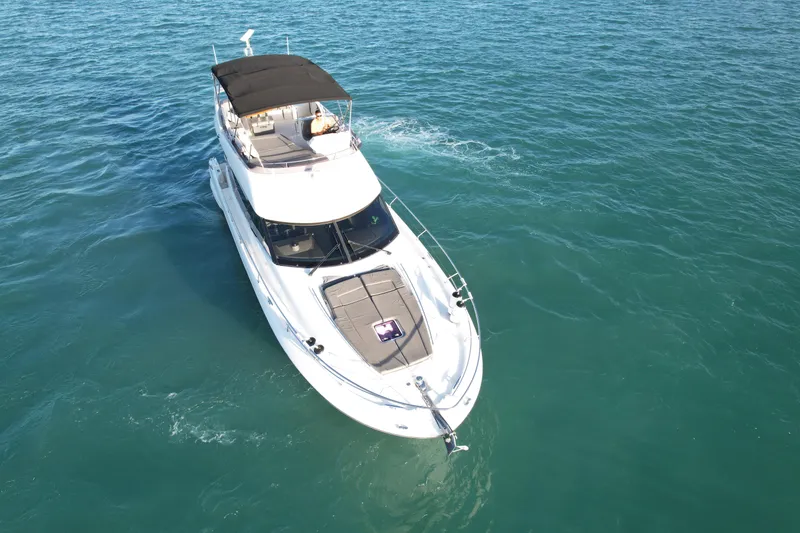 Slide: The Image of Prestige 50 Flybridge 2014 yacht cruising on clear blue water. - 22