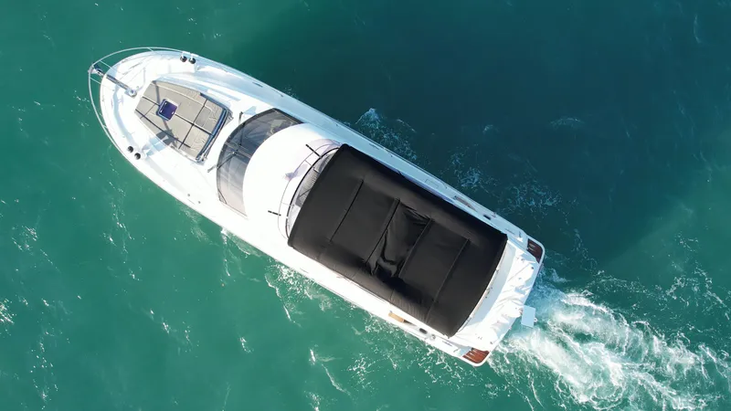 Slide: The Image of Aerial view of 2013 Prestige 50 Flybridge yacht cruising on blue water. - 23