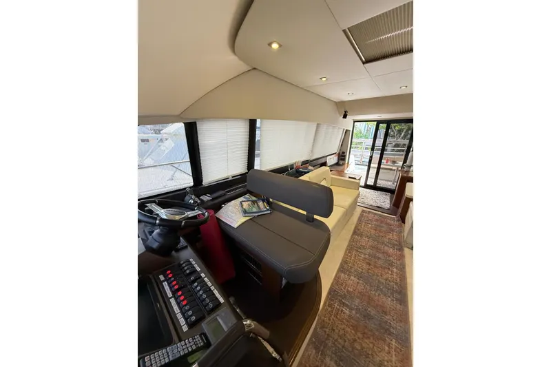 Slide: The Image of Interior of 2013 Prestige 50 Flybridge yacht with helm and seating area. - 4