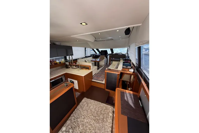 Slide: The Image of Luxurious interior of 2013 Prestige 50 Flybridge yacht with modern kitchen and seating area. - 5