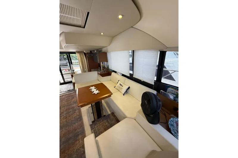 Slide: The Image of Luxurious interior of 2013 Prestige 50 Flybridge yacht with elegant seating and table. - 8