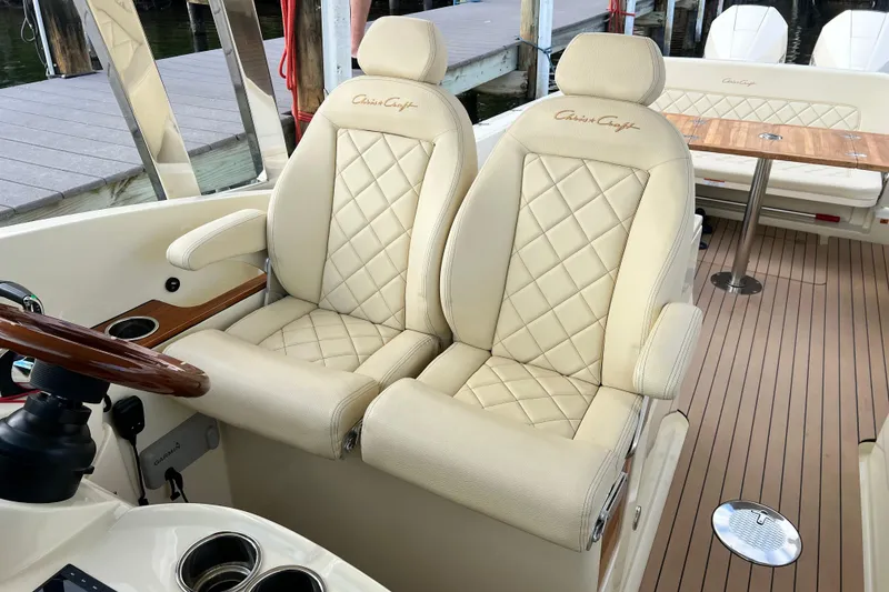 Slide: The Image of Luxurious 2023 Chris-Craft Calypso 30 boat interior with elegant cream leather seating. - 14