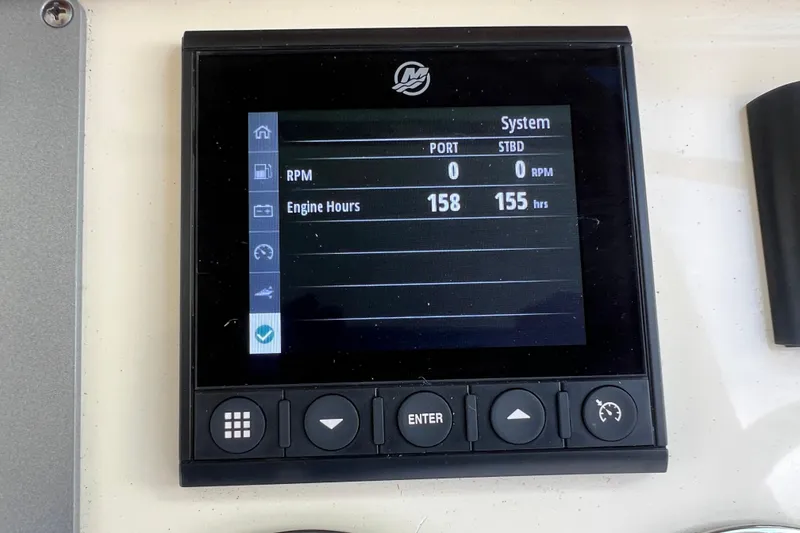 Slide: The Image of Display panel of 2023 Chris-Craft Calypso 30 showing engine hours and RPM. - 21