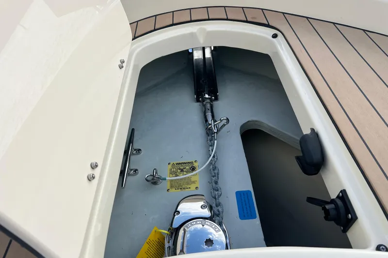 Slide: The Image of 2023 Chris-Craft Calypso 30 anchor compartment with chain and winch system. - 22
