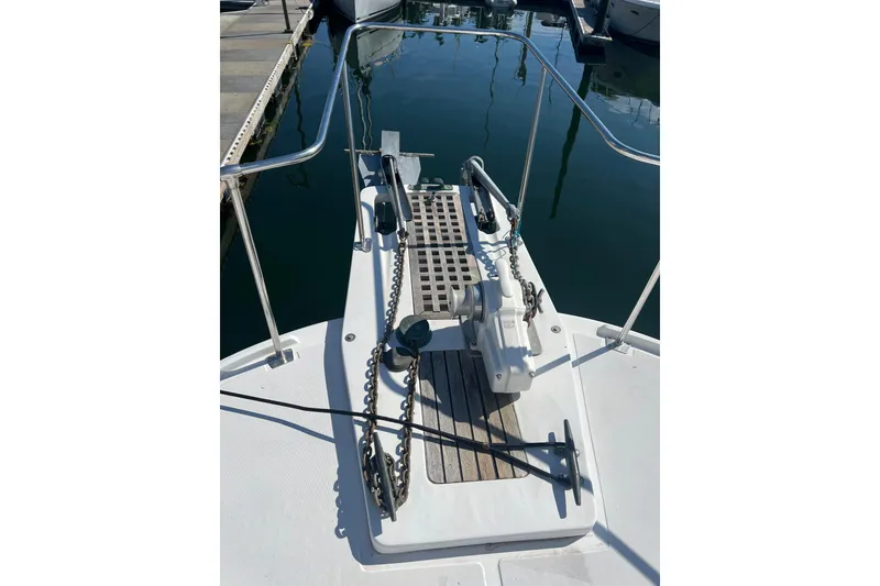 Slide: The Image of 1987 Kadey-Krogen Manatee 36 boat deck with anchor and railing at marina. - 11