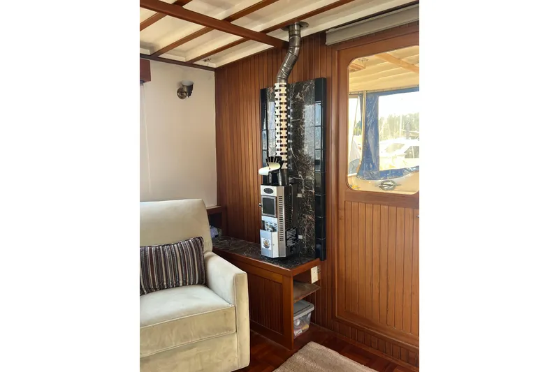 Slide: The Image of Interior of 1987 Kadey-Krogen Manatee 36 with cozy seating and wood paneling. - 9