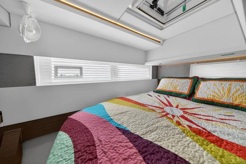 Slide: The Image of Luxurious bedroom interior of 2024 Leopard 45 yacht with colorful bedding and modern design. - 106