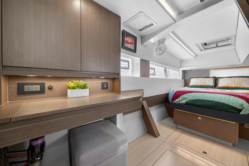 Slide: The Image of Luxurious interior of 2024 Leopard 45 yacht with modern bedroom and workspace. - 108
