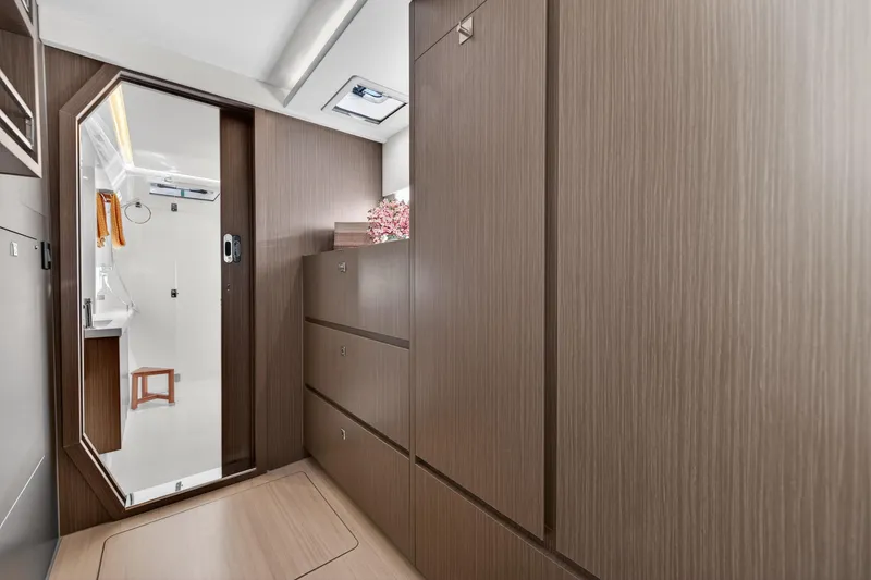 Slide: The Image of Modern interior of 2024 Leopard 45 yacht with sleek wood cabinetry and bathroom view. - 109