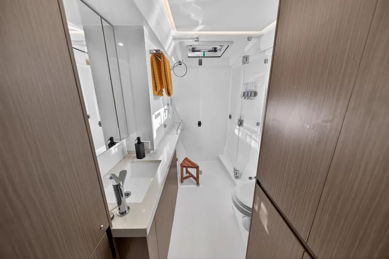 Slide: The Image of Modern bathroom interior on 2024 Leopard 45 yacht, featuring sleek design and wooden accents. - 111