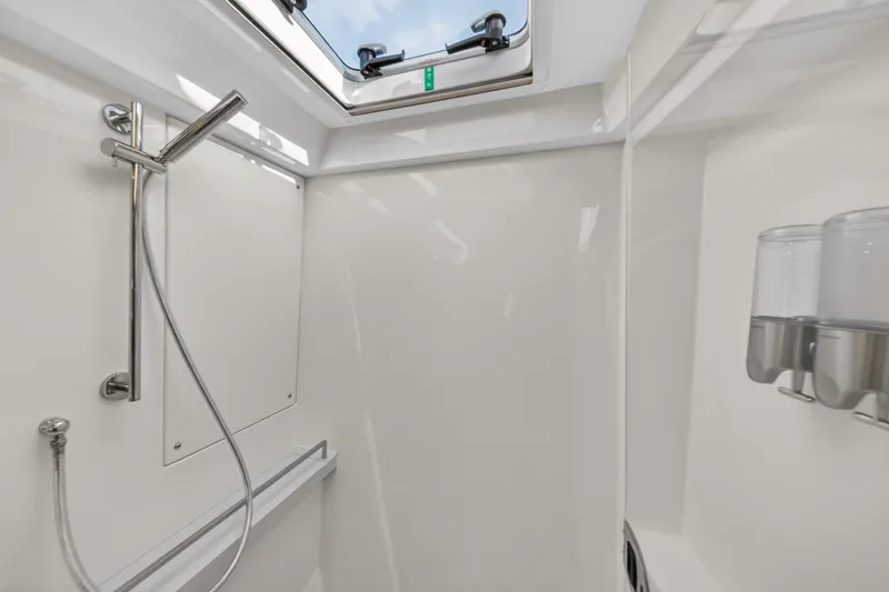 Slide: The Image of Modern shower area in 2024 Leopard 45 yacht with skylight and dispensers. - 113