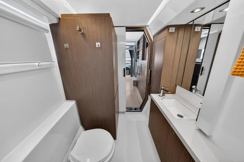 Slide: The Image of Modern bathroom interior of 2024 Leopard 45 yacht, featuring sleek wood finishes and contemporary fixtures. - 114