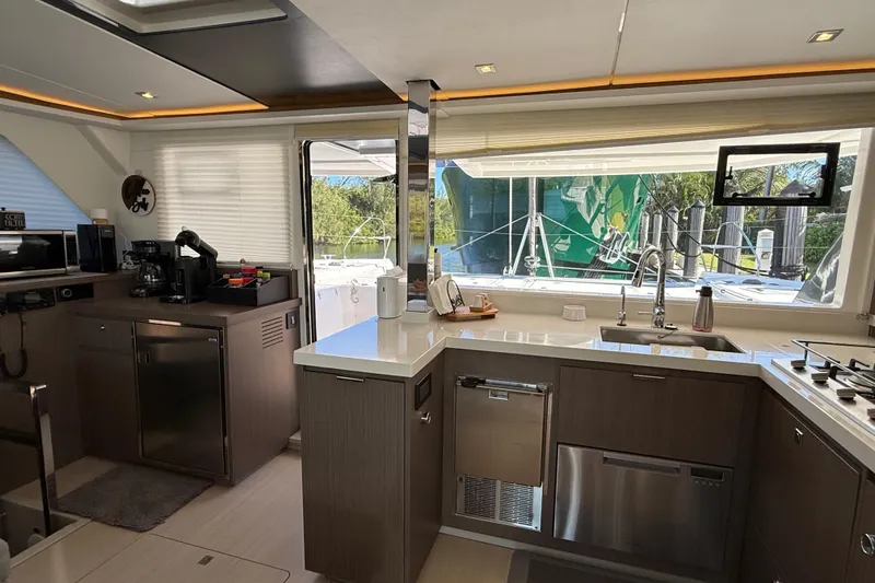 Slide: The Image of Modern kitchen interior of 2024 Leopard 45 yacht with sleek appliances and large windows. - 17