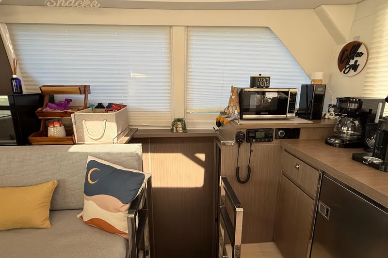 Slide: The Image of Modern kitchen interior on 2024 Leopard 45 yacht with appliances and cozy decor. - 24