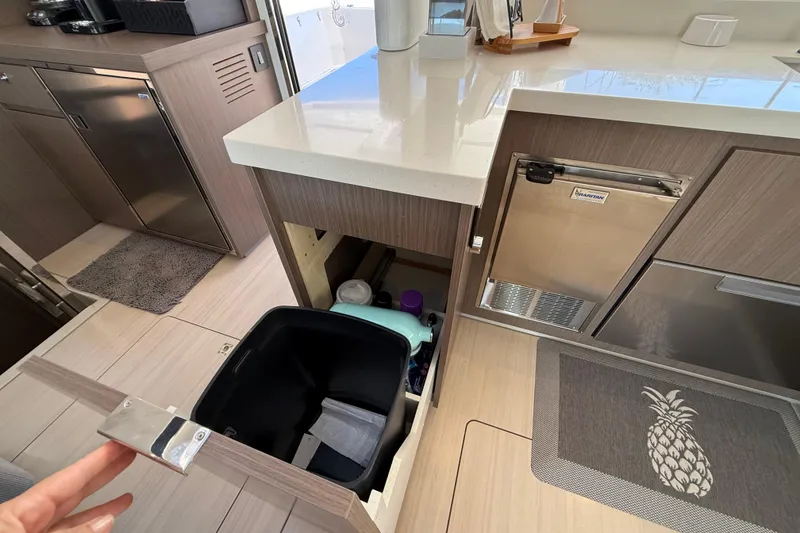 Slide: The Image of Modern kitchen area in a 2024 Leopard 45 yacht with sleek cabinetry and appliances. - 25