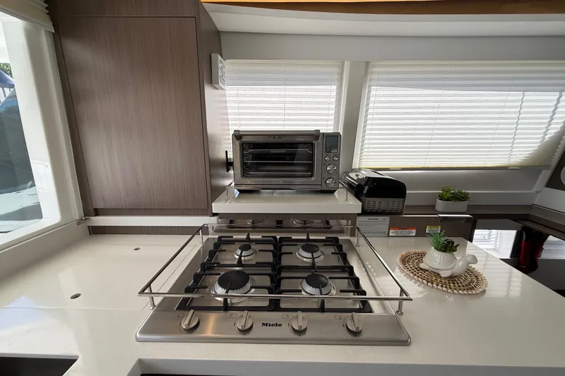 Slide: The Image of Modern kitchen in 2024 Leopard 45 yacht with stove, oven, and decor. - 30