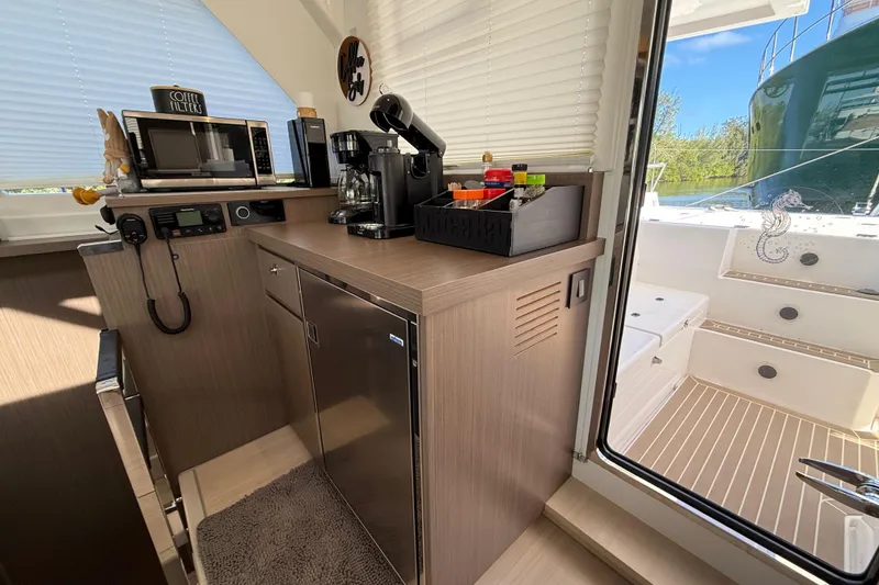 Slide: The Image of Modern kitchen area on 2024 Leopard 45 yacht with appliances and outdoor view. - 31