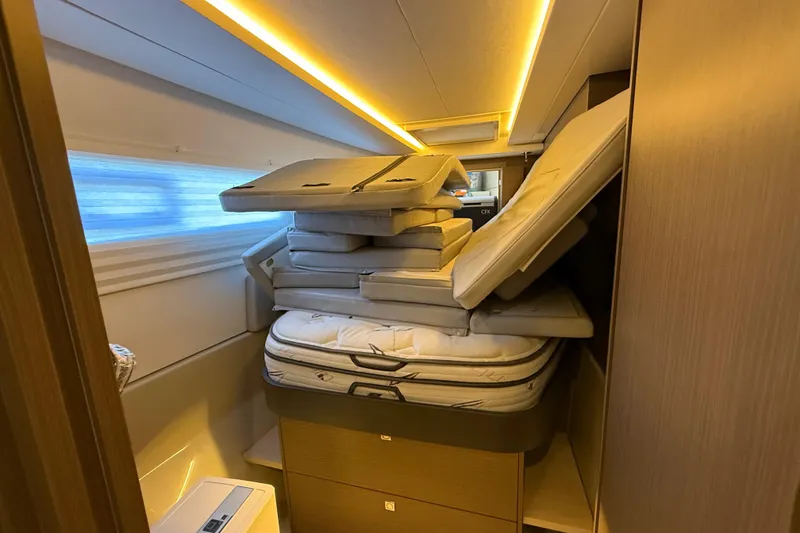 Slide: The Image of Interior of 2024 Leopard 45 yacht with stacked cushions and modern lighting. - 36