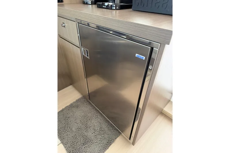 Slide: The Image of Stainless steel fridge in 2024 Leopard 45 yacht interior. - 37